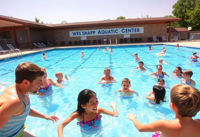 Sign of Wes Snapp Aquatic Center with families swimming